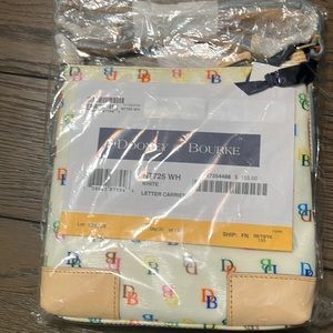 Brand new still in bag Dooney & Bourke letter carrier bag